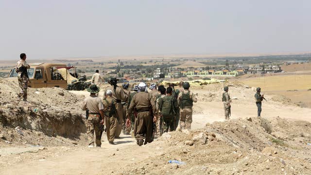 Iraq forces look to take back Hussein’s hometown