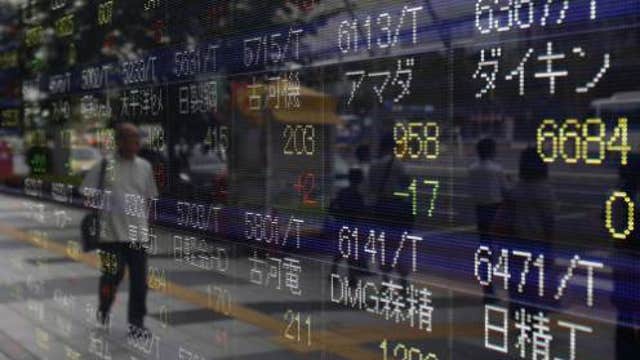 Asian shares mostly higher, helped by S&P record
