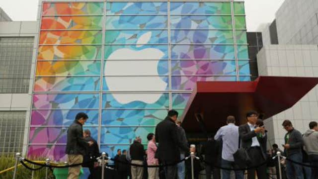 Apple fans line up at stores ahead of new product release