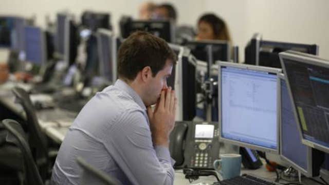 European shares mostly lower, UK inflation falls to 1.5%