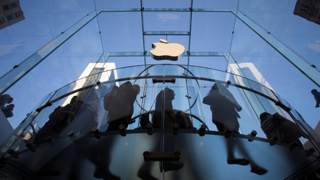 Apple shares finish lower on day iPhone 6 goes on sale