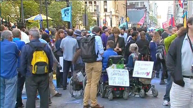 Climate change protestors descend on Wall Street