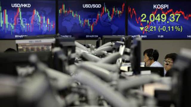 Asian markets mostly lower on global growth concerns