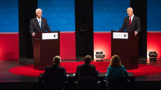 Scott, Crist battle over fan delays at Florida Governor's debate