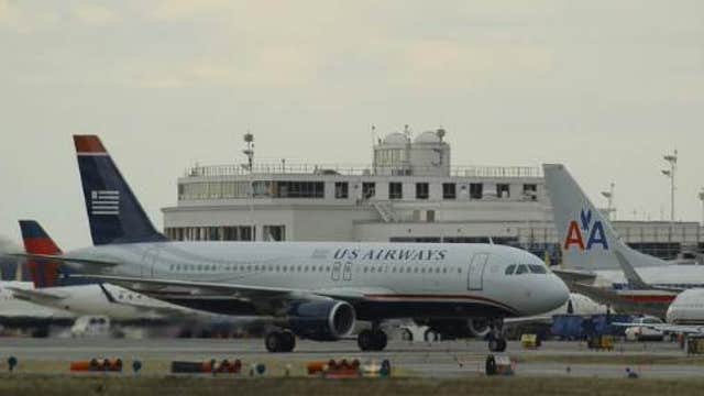 US Airways, AMR agree to divestitures in merger settlement