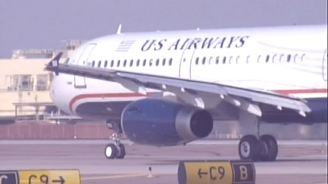 American, US Airways reach merger settlement with DOJ