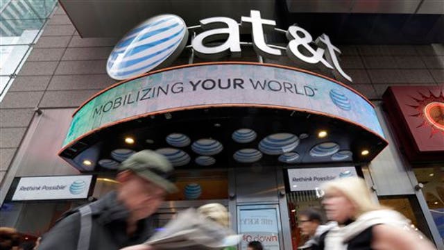 AT&T CEO: Consumers spending, but businesses are slowing down