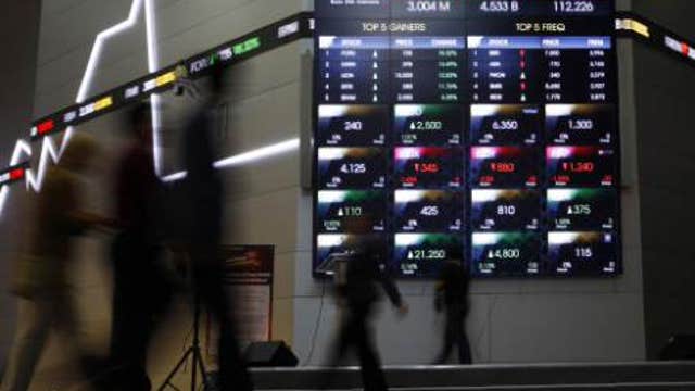 Asian markets slip into the red