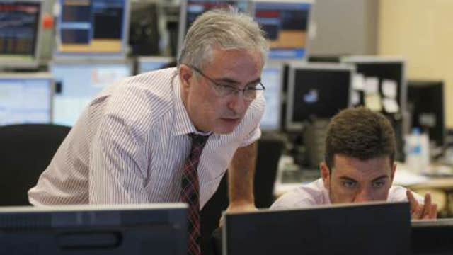 European shares lower on weak PMI data, oil prices