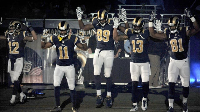 Ferguson tensions still high as Rams players protest