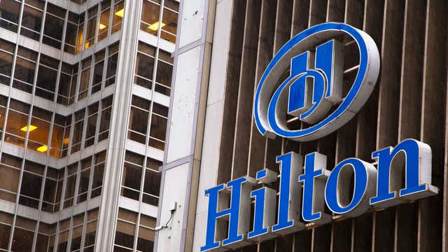 Hilton begins trading on the NYSE