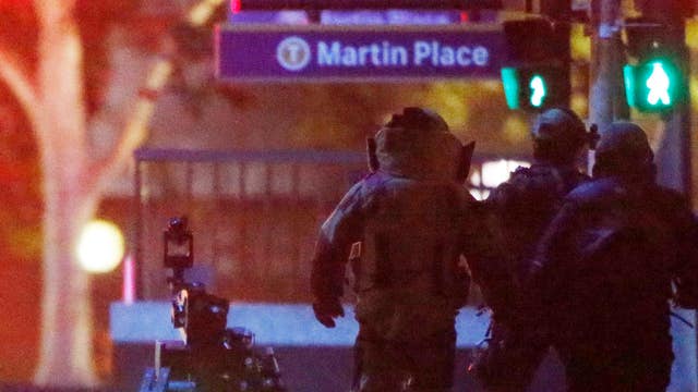 Sydney hostage crisis grips global media
