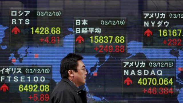 Asian markets mostly lower, Shanghai gains