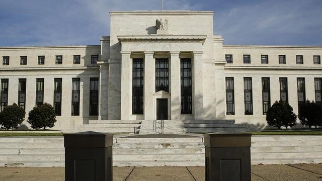 Fed changes guidance on rate hikes