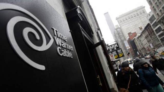 FCC pauses Comcast-Time Warner merger review