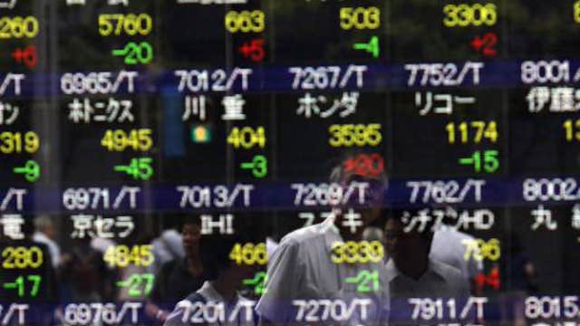 Asian markets mixed, China shares gain