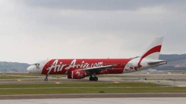 Dozens of bodies, debris found in search for AirAsia plane