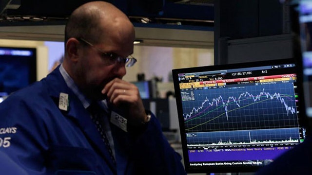 Dow plummets triple digits amid falling oil prices