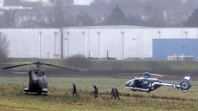 French terror suspects hold hostage in print shop