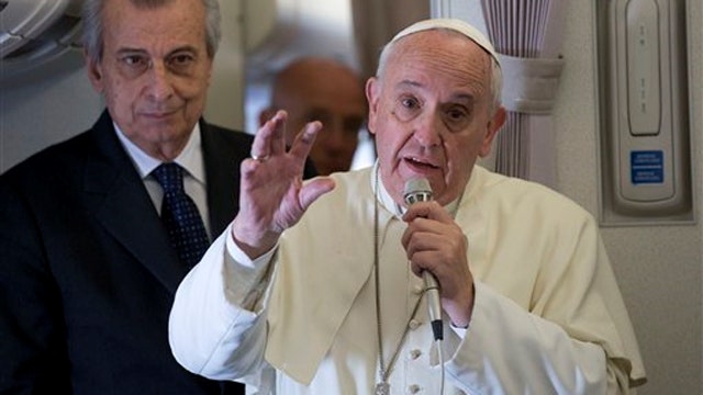 Pope says Catholics don't have to breed 'like rabbits'