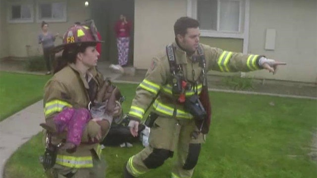 Firefighters rescue three children trapped in apartment fire