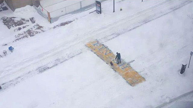 Unidentified man shovels Boston Marathon finish line