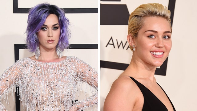 Miley gets handsy with Katy at Grammys