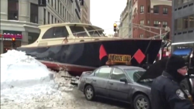 Yacht stuck in snow snarls Boston traffic