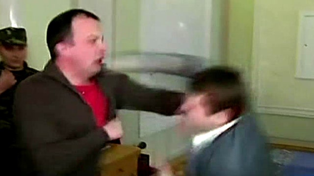 Bloodied lawmakers trade punches in Ukrainian Parliament