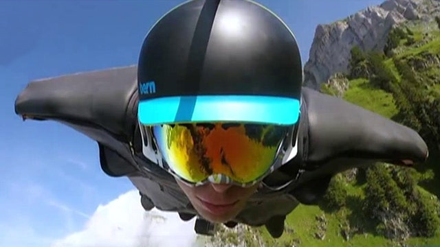 Daredevil in wingsuit flies through Swiss mountains