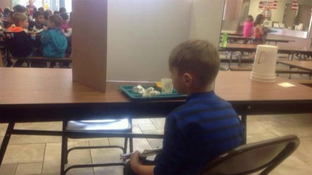 Tardy 1st grader forced to sit behind divider at lunchtime