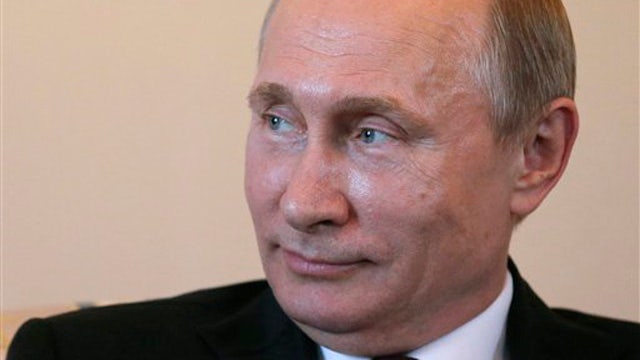Vladimir Putin appears at press conference