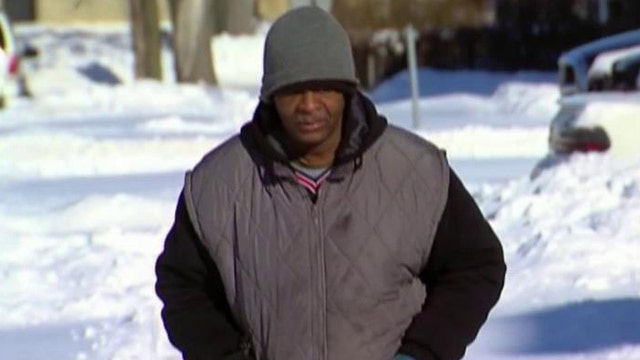 Detroit walking man's ex demands cut of donations