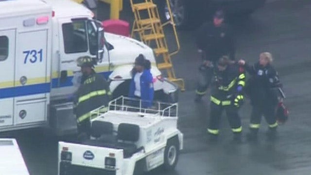 Baggage handler calls 911 after getting stuck in cargo hold