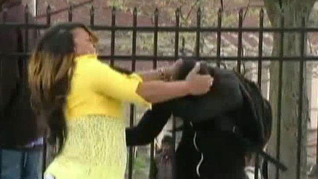 Mom slaps son after seeing him throwing rocks at police