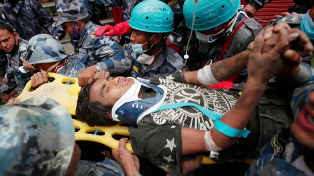 Crews pull 18-year-old survivor from rubble of Nepal quake