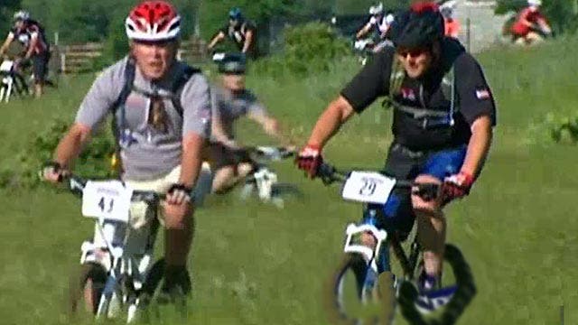 George W. Bush gets back on his bike to honor our heroes