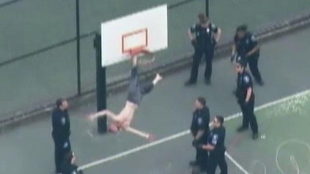 First responders save shirtless man stuck in basketball hoop