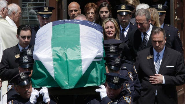 Thousands of cops gather for funeral of NYPD officer