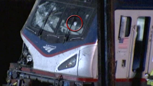 Investigators examine whether object hit derailed train