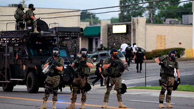 President Obama bans some military equipment for police