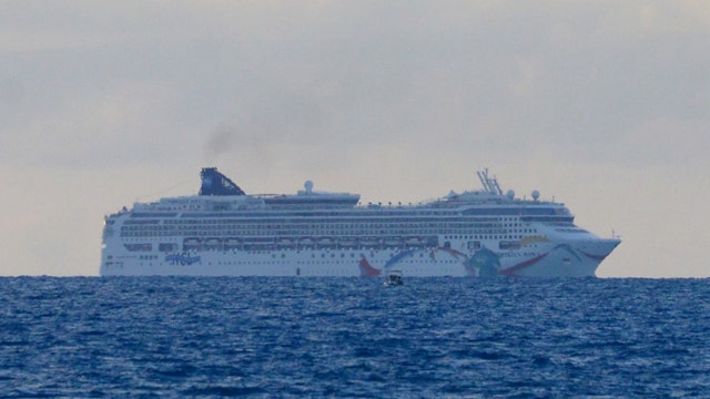 Cruise ship pulled free after running aground on reef