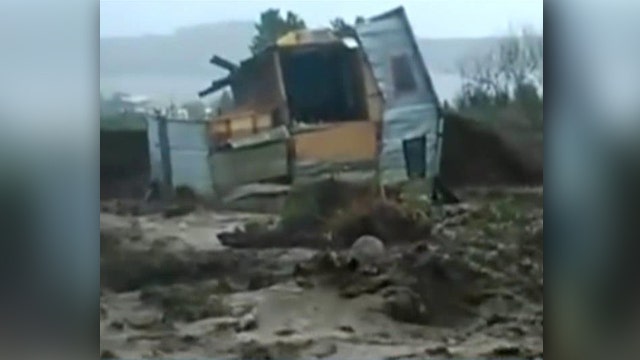 Raging floodwaters sweep away homes in Chile