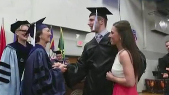 Formerly paralyzed student walks stage after years of rehab