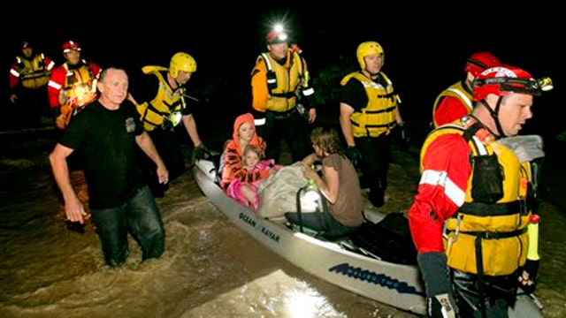 Rescue crews pull dozens of people from floodwaters in Texas