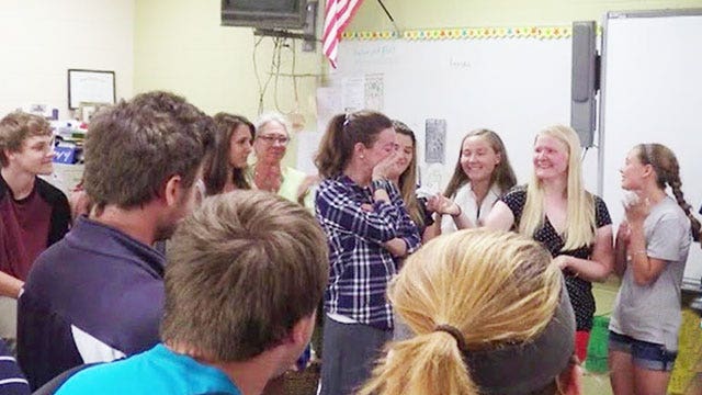 Students cancel trip, give cash to principal battling cancer