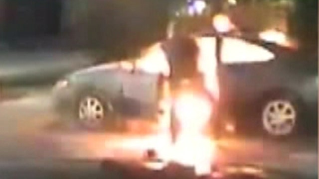 Cops injured when suspect sets car on fire