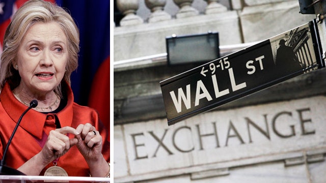 Wall Street titans clash over Hillary Clinton's campaign