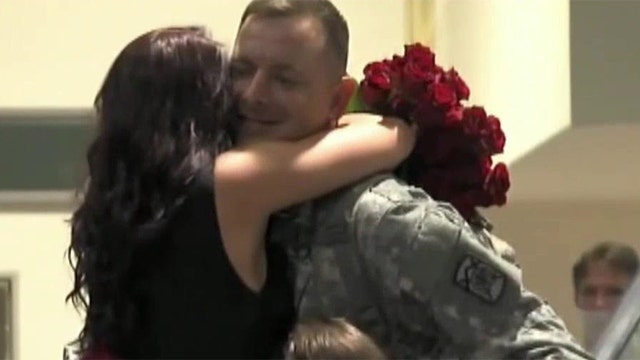 Returning soldier surprises girlfriend with airport proposal