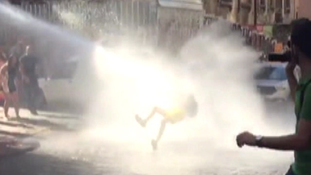 Police blast LGBT protester with water cannon